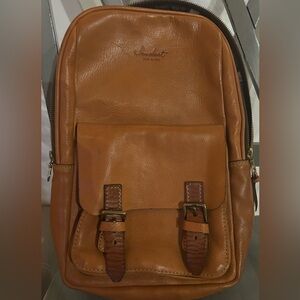 Sandast leather backpack.  Does not have straps.